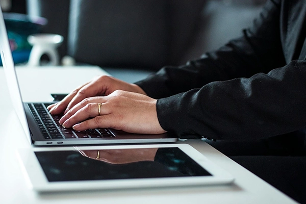 man-in-black-dress-shirt-using-laptop
