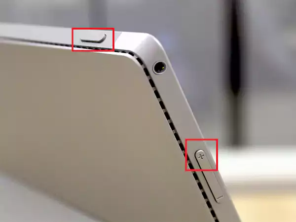 Press the Volume Up and Power button together