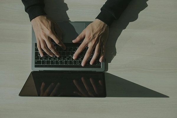hands-typing-on-a-laptop-keyboard