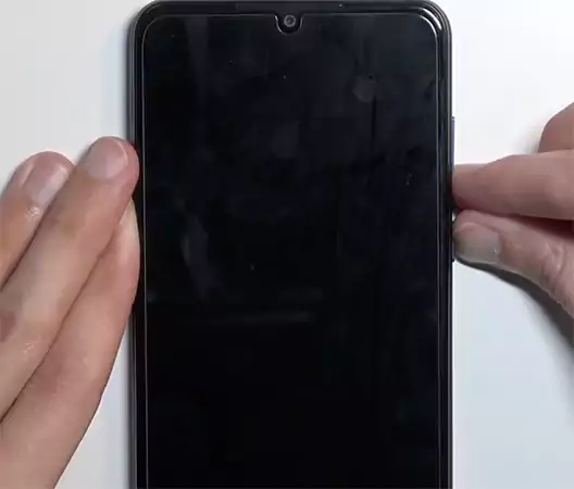 Hold the power and Volume Down buttons