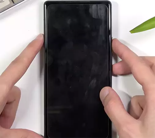 Press and hold the Power plus Volume Down keys