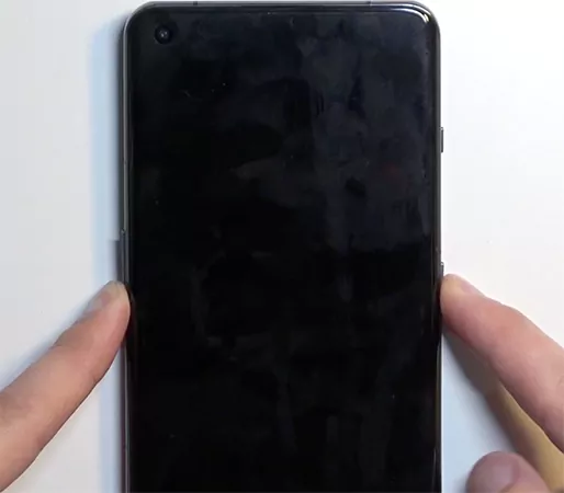 Press and hold the Power and Volume Down buttons