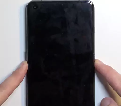 Press and hold the Power and Volume Down buttons