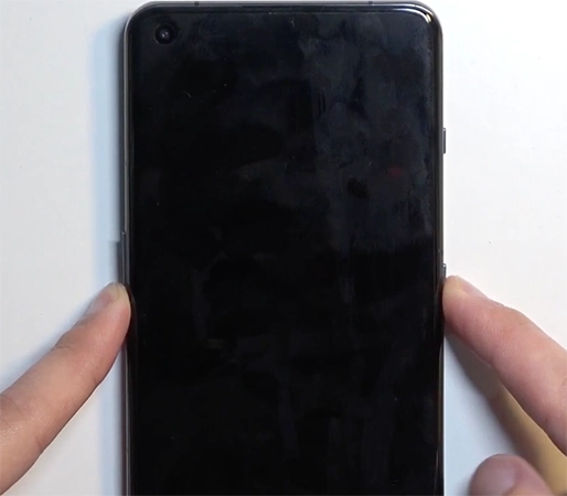 Press and hold the Power and Volume Down buttons